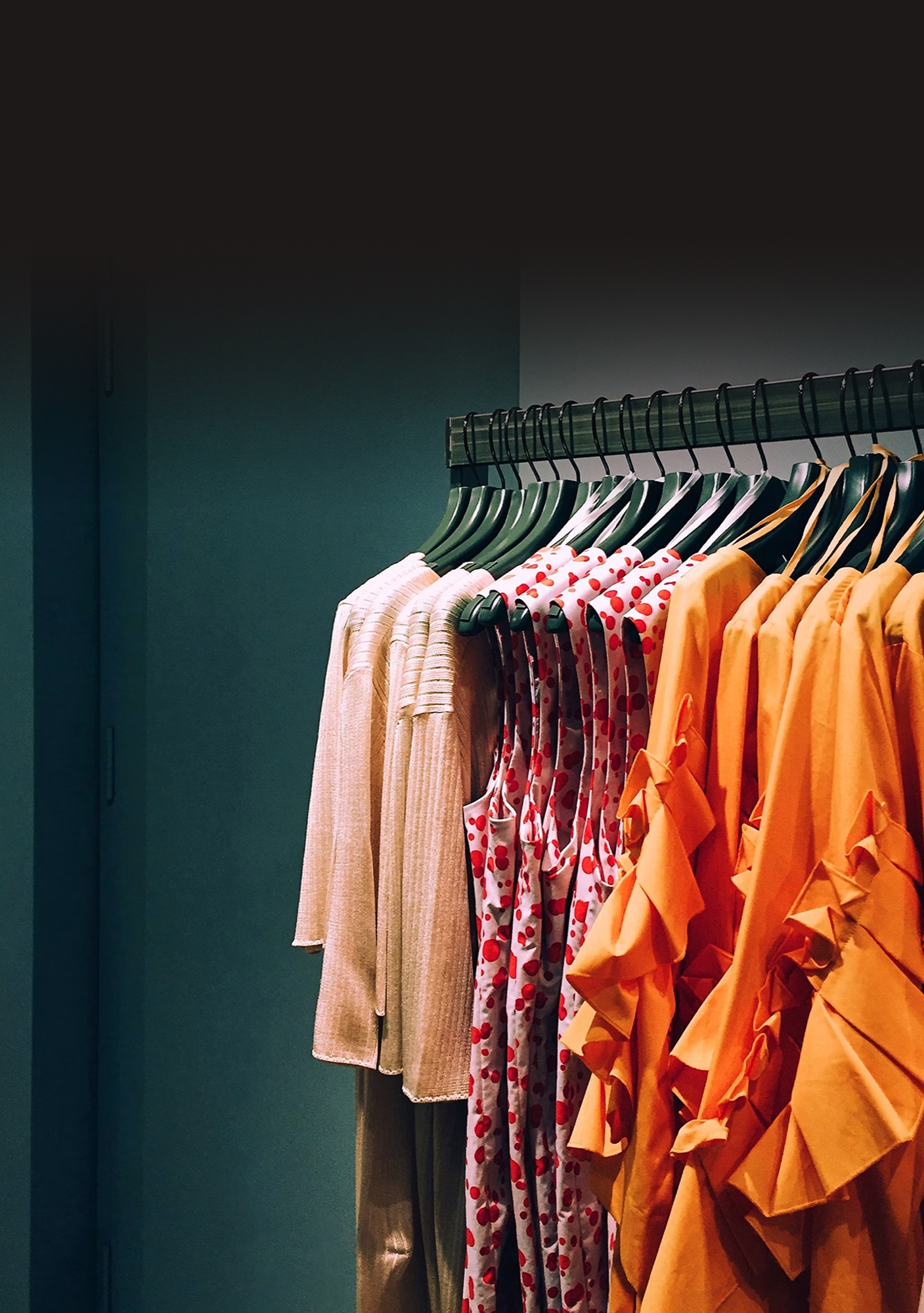 Clothing displayed on a rack inside a retail store