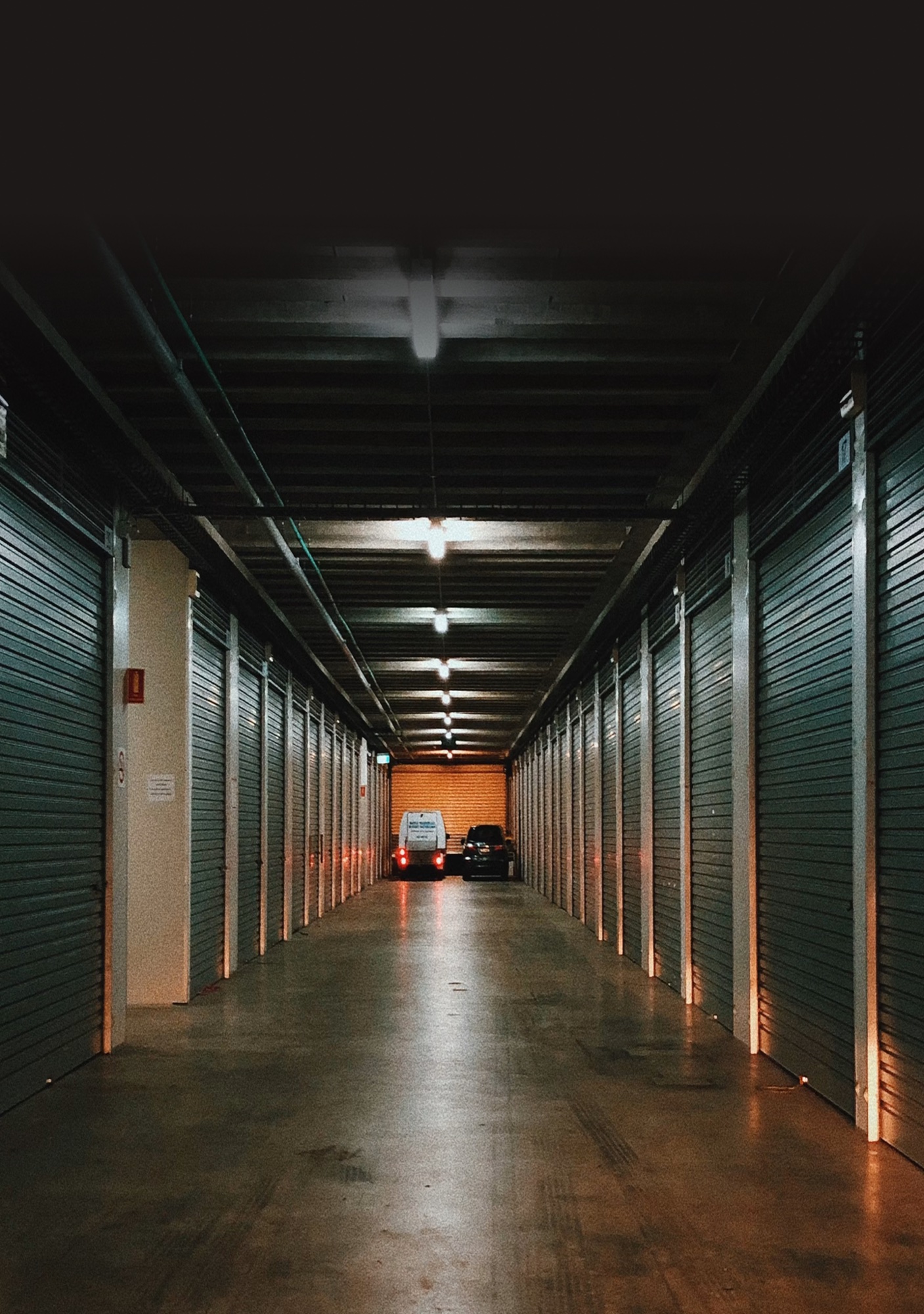A corridor lined with self-storage units
